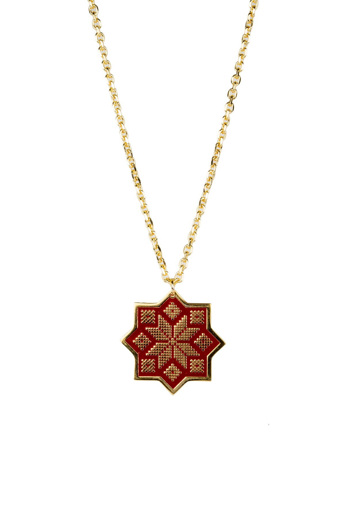 A gold chain necklace featuring a geometric star-shaped pendant with a red and gold embroidered pattern, set against a plain white background.